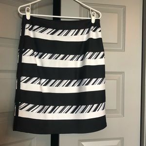 Black and white tiered skirt. Office appropriate.